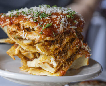 Closeup of lasagna being plated